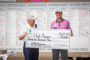 Co-tournament director and co-founder Jim McPartland (left) presents 2015 winner Sam Aypan with the goods last July. (Draeger Photography) 