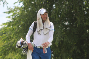 Josh Weems (Lake Quivira, KS) tries to cool down and hydrate at Friday's second round of the TrueNorth GCRO at steamy Hunters Ridge Golf Course. 